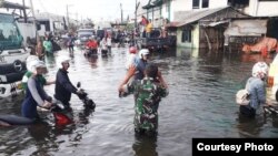 Banjir akibat hujan deras dan tanggul jebol di dekat Pelabuhan Semarang, Rabu, 23 Mei 2018. (Foto: BPBD Kota Semarang)