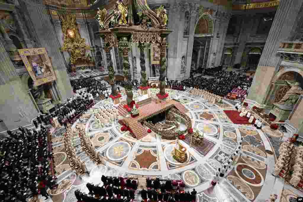 In this photo provided by Vatican Media, Pope Francis presides over the Christmas Eve Mass in St. Peter's Basilica at The Vatican, Dec. 24, 2024.