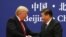 U.S. President Donald Trump and Chinese President Xi Jinping shake hands during a business event at the Great Hall of the People in Beijing, Nov. 9, 2017.