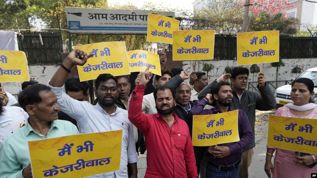 Supporters of the Aam Aadmi Party, or Common Man's Party, shout outside the office of India's ruling Bharatiya Janata Party in New Delhi, India, March 22, 2024. Anti-corruption crusader and AAP leader Arvind Kejriwal was arrested Thursday by the federal investigative agency.