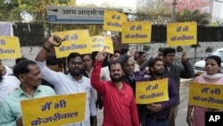Supporters of the Aam Aadmi Party, or Common Man's Party, shout outside the office of India's ruling Bharatiya Janata Party in New Delhi, India, March 22, 2024. Anti-corruption crusader and AAP leader Arvind Kejriwal was arrested Thursday by the federal investigative agency.
