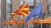 FILE - Macedonian and European flags fly side by side in Macedonia's capital Skopje, March 15, 2012.