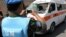 U.N. observer photographs ambulance destroyed after a nearby car-bomb explosion, Damascus, June 14, 2012.