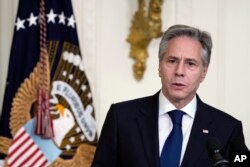 U.S. Secretary of State Antony Blinken speaks at a chiefs of mission reception in the East Room of the White House in Washington, June 13, 2023. Blinken and Chinese Foreign Minister Qin Gang shared concerns on a phone call, June 14, 2023, ahead of a planned visit by the U.S. official to China meant to shore up relations.