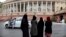 Indian Muslims stand outside Parliament House in New Delhi, India, Friday, July 26, 2019. 