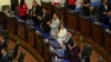 Representatives celebrate after a session of El Salvador's Congress that approved a bill from President Nayib Bukele that overturned a 2017 national ban on metals mining, in San Salvador, Dec. 23, 2024.