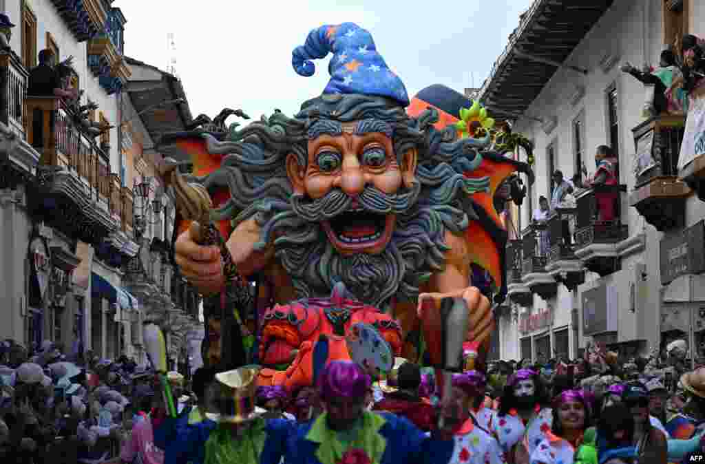 Artists perform with traditional floats during the &quot;Blacks and Whites&quot; carnival parade in Pasto, Colombia, Jan. 6, 2025.