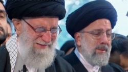 FILE - In this image taken from video, Iranian Supreme Leader Ayatollah Ali Khamenei, left, openly weeps as he leads a prayer over the coffin of General Qassem Soleimani, in Tehran, Iran, Jan. 6, 2020.