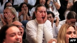 Dana Shem Tov, sister of Israeli hostage Omer Shem Tov, reacts as she watches his televised release by Hamas militants at the family home in Tel Aviv on Feb. 22, 2025.