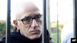 Norman Atlantic ferry captain Argilio Giacomazzi talks with journalists outside his home in Campiglia, near La Spezia, Italy, Jan. 1, 2015.