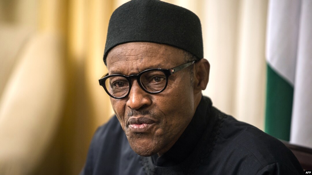 FILE - Nigerian president Muhammadu Buhari gives an interview to Agence France-presse at his hotel during the 25th African Summit on June 14, 2015 in Johannesburg. 