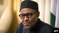 FILE - Nigerian president Muhammadu Buhari gives an interview to Agence France-presse at his hotel during the 25th African Summit on June 14, 2015 in Johannesburg. 