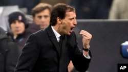 AC Milan coach Massimiliano Allegri gestures during a Champions League, Group H, soccer match between AC Milan and Ajax at the San Siro stadium in Milan, Italy, Wednesday, Dec. 11, 2013. (AP Photo/Antonio Calanni)