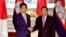 Cambodian Prime Minister Hun Sen, right, poses with his Japanese counterpart Shinzo Abe prior to their meeting at the state guesthouse in Tokyo Monday, Aug. 7, 2017. Hun Sen is on a four-day official visit to Japan. (Toshifumi Kitamura/Pool Photo via AP)