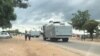 Police monitoring people outside the Chitungwiza Magistrates' Courts on Monday. (Photo: Thomas Chiripasi)