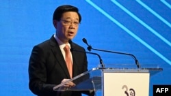 香港特区行政长官李家超2023年11月7日在国际金融领袖投资峰会致辞。（法新社）