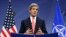 U.S. Secretary of State John Kerry speaks at a news conference during a NATO foreign ministers meeting in Brussels December 3, 2013.