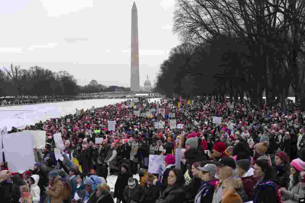 With the Washington Monument successful  the background, demonstrators protestation  President-elect Donald Trump's incoming medication  astatine  the Lincoln Memorial during the People's March, Jan. 18, 2025, successful  Washington. 