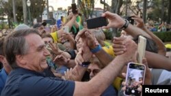 El actual presidente de Brasil, Jair Bolsonaro, asiste a un acto de campaña en Belo Horizonte, Brasil, el 24 de agosto de 2022.