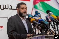 FILE - Senior Hamas official Osama Hamdan speaks during a rally organized by Lebanon's militant Hezbollah group to express solidarity with the Palestinian people, in the southern suburb of Beirut, Lebanon, May 17, 2021.