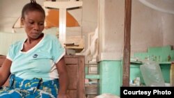 FILE - Antho watches over her son Kaba, two, who is being treated for cerebral malaria at the Tshilundu Referral Hospital in Kasai Oriental Province, DRC. Kaba is now in a coma. Antho is nine months pregnant. This is her eighth pregnancy; she had two miscarriages.