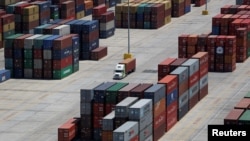 FILE - Shipping containers are stacked for storage at Wando Welch Terminal operated by the South Carolina Ports Authority in Mount Pleasant, South Carolina, U.S., May 10, 2018.