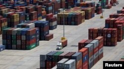 FILE - Shipping containers are stacked for storage at Wando Welch Terminal operated by the South Carolina Ports Authority in Mount Pleasant, South Carolina, U.S., May 10, 2018.