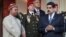 OPEC Secretary-General Mohammed Barkindo talks to reporters while standing with Venezuela's President Nicolas Maduro after their meeting at Miraflores Palace in Caracas, Venezuela, Nov. 16, 2016.