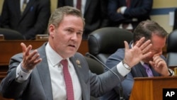 FILE - Representative Mike Waltz speaks during a hearing in Washington, July 22, 2024. Waltz, who was nominated by Trump this week to be his national security adviser, told VOA that Trump “is focused on ending the war and not perpetuating it.”