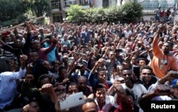 Oromo youth shout slogans outside Jawar Mohammed's house, an Oromo activist and leader of the Oromo protest in Addis Ababa, Ethiopia, Oct. 23, 2019.