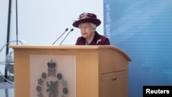 Britain's Queen Elizabeth II speaks during a visit to the headquarters of MI5, which is the United Kingdom's domestic counter-intelligence and security agency, at Thames House in London, February 25, 2020. 