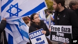 People attend a demonstration in support of Israel to mark the first anniversary of the Hamas attack on Israel, at the Brandenburg Gate in Berlin, Germany, Oct. 6, 2024.