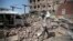A man inspects rubble after a Saudi-led coalition airstrike in Sanaa, Yemen, Feb. 4, 2018.