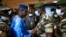 FILE - Issa Kaou N'Djim, left, greets Colonel Malick Diaw of what was then the ruling junta, prior to talks on a transitional government in Mali, Sept. 5, 2020, in Bamako. N'Djim was jailed Dec. 30, 2024, for criticizing Burkina Faso's rulers. 