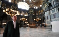 This handout picture released by the Turkish Presidential press office shows Turkish President Recep Tayyip Erdogan visiting Hagia Sophia in Istanbul, July 19, 2020.