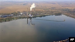 An aerial view of the reservoir storing chemical waste of Bokod thermal power station, 87 kms northwest of Budapest, Hungary, as an aerial surveillance of reservoirs throughout Hungary is performed in the aftermath of the toxic red mud flood disaster that