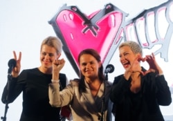 BELARUS -- Presidential candidate Svyatlana Tsikhanouskaya (C), Veranika Tsapkala (L) and Maryya Kalesnikava attend an election campaign rally in Minsk, July 30, 2020.