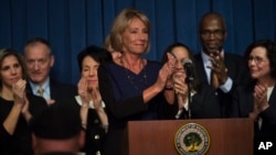 Education Secretary Betsy DeVos is applauded after addressing the staff at the Department of Education, Feb. 8, 2017, in Washington.