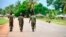FILE - In this file photo taken March 7, 2018, soldiers from the Mozambican army patrol the streets after security in the area was increased, in Mocimboa da Praia, Mozambique.