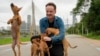 Director Diego Freitas plays with caramelo dogs on the set of the Netflix film 'Caramelo' in Sao Paulo, Oct. 29, 2024. 