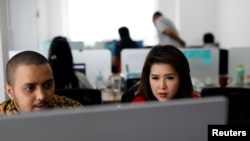 The leader of the Indonesian Solidarity Party, Grace Natalie, right, believes the time has come for a new, more accountable generation of politicians, at the party's headquarters in Jakarta, Indonesia, March 19, 2018. 