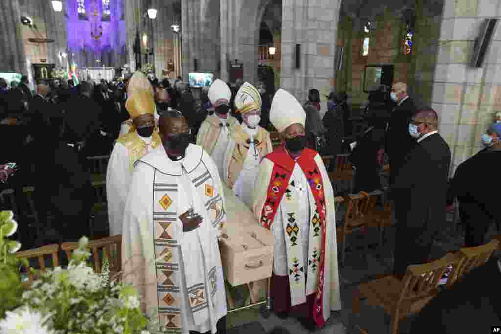 The coffin is carried out of the cathedral at the end of the funeral service for Anglican Archbishop Emeritus Desmond Tutu in St. George&#39;s Cathedral in Cape Town, South Africa, Jan. 1, 2022.