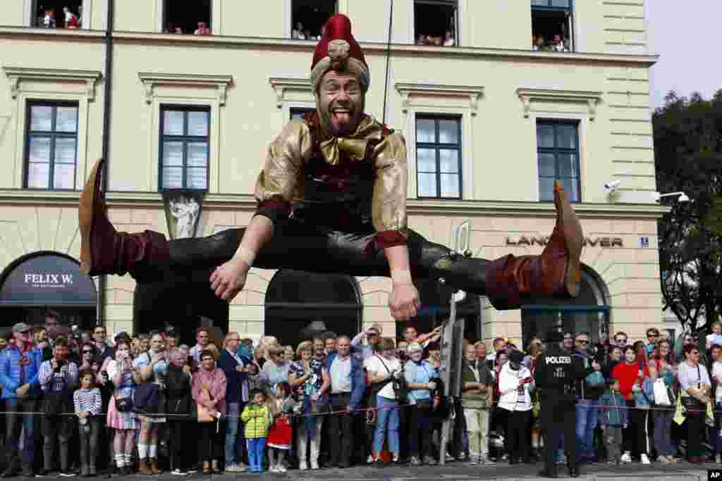 A man dressed in historical clothes takes part in the traditional costume and rifle men parade at the second day of the 185th Oktoberfest beer festival in Munich, Germany.