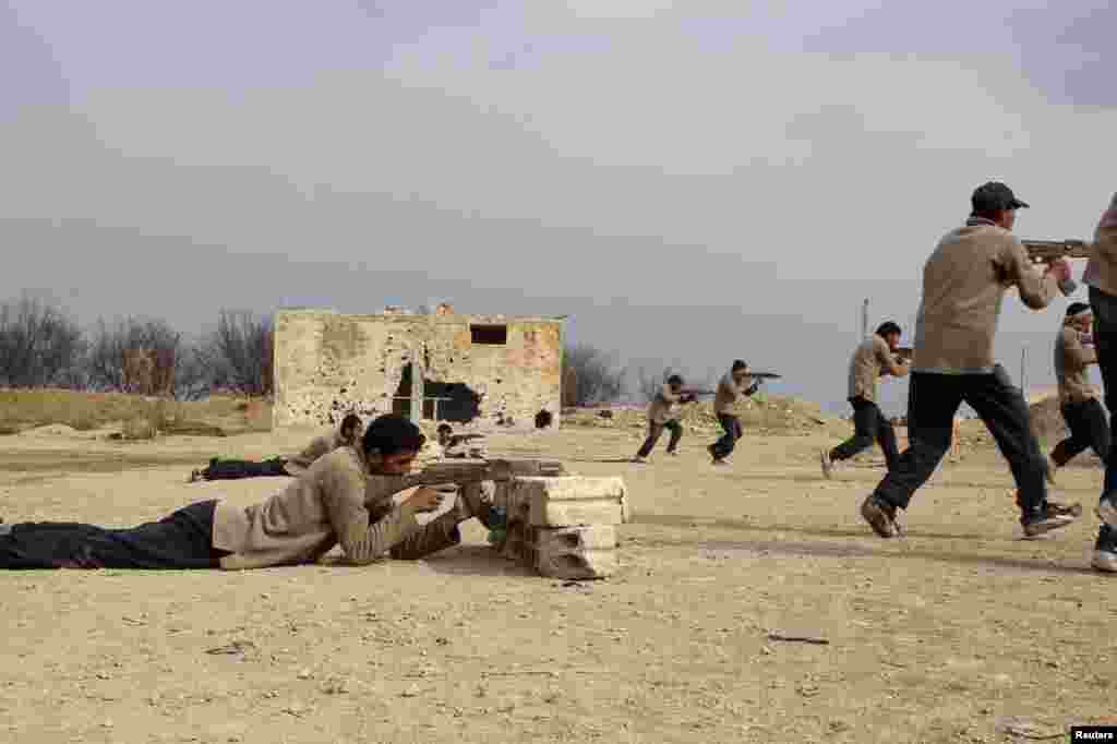 New recruits attend military training to be part of the Free Syrian Army in eastern al-Ghouta, near Damascus, Feb. 16, 2014. 