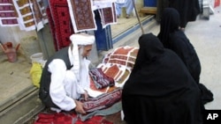 An Iranian man sells traditional embroidered fabric in the Bazaar of the southeastern city of Zahedan, on the border with Afghanistan (file photo)