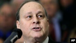 FILE - Former Massachusetts Senate President Stanley Rosenberg speaks during a bill-signing ceremony at the Statehouse in Boston, March 14, 2016. Rosenberg has resigned his state Senate seat after an ethics investigation regarding his husband.