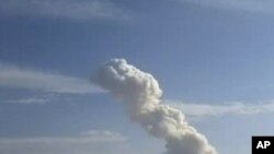 In this image taken from amateur video, smokes rises from an accidental explosion at a Revolutionary Guard ammunition depot outside Tehran on Saturday Nov. 12, 2011.