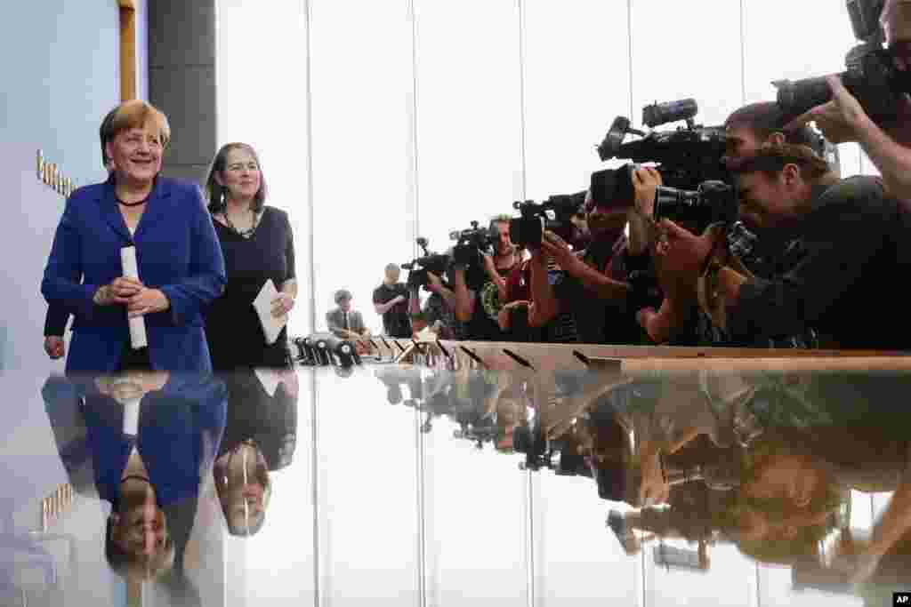 German Chancellor Angela Merkel leaves a news conference in Berlin.