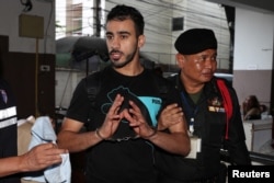 Hakeem AlAraibi, a former member of Bahrain's national soccer team who holds a refugee status in Australia arrives at court after he was arrested on arrival at a Bangkok airport.