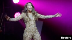 Jennifer Lopez performs at the Muhammad Ali Celebrity Fight Night Awards XIX in Phoenix, Arizona March 23, 2013. The charity event is held in honor of Muhammad Ali's fight to find a cure for Parkinson's disease, according to the organisers. Picture taken 